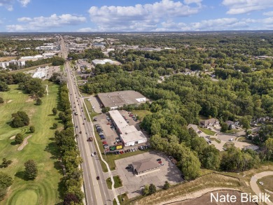 Great opportunity for a fully leased automotive retail Grand on Indian Trails Golf Course in Michigan - for sale on GolfHomes.com, golf home, golf lot