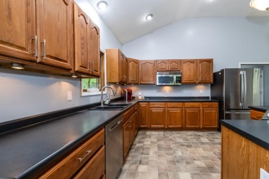 Nestled in a quiet cul-de-sac, this beautifully updated on Point O Woods Country Club in Michigan - for sale on GolfHomes.com, golf home, golf lot