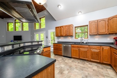 Nestled in a quiet cul-de-sac, this beautifully updated on Point O Woods Country Club in Michigan - for sale on GolfHomes.com, golf home, golf lot