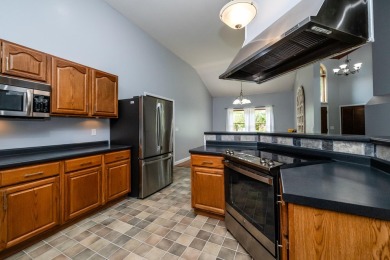 Nestled in a quiet cul-de-sac, this beautifully updated on Point O Woods Country Club in Michigan - for sale on GolfHomes.com, golf home, golf lot