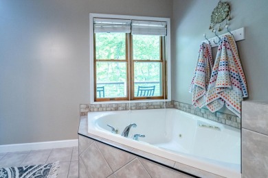 Nestled in a quiet cul-de-sac, this beautifully updated on Point O Woods Country Club in Michigan - for sale on GolfHomes.com, golf home, golf lot