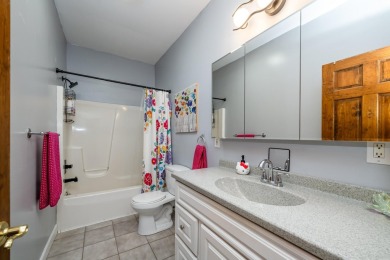 Nestled in a quiet cul-de-sac, this beautifully updated on Point O Woods Country Club in Michigan - for sale on GolfHomes.com, golf home, golf lot