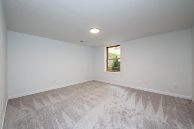 Nestled in a quiet cul-de-sac, this beautifully updated on Point O Woods Country Club in Michigan - for sale on GolfHomes.com, golf home, golf lot