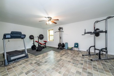 Nestled in a quiet cul-de-sac, this beautifully updated on Point O Woods Country Club in Michigan - for sale on GolfHomes.com, golf home, golf lot