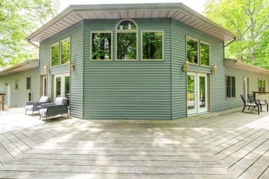 Nestled in a quiet cul-de-sac, this beautifully updated on Point O Woods Country Club in Michigan - for sale on GolfHomes.com, golf home, golf lot