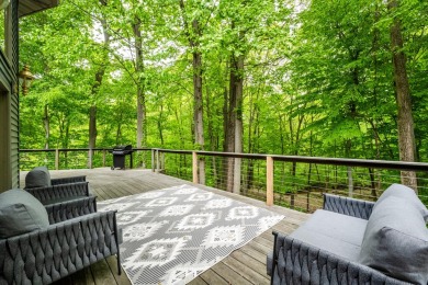 Nestled in a quiet cul-de-sac, this beautifully updated on Point O Woods Country Club in Michigan - for sale on GolfHomes.com, golf home, golf lot