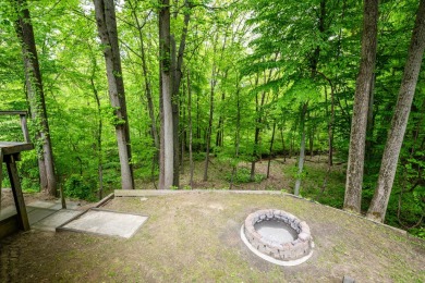 Nestled in a quiet cul-de-sac, this beautifully updated on Point O Woods Country Club in Michigan - for sale on GolfHomes.com, golf home, golf lot