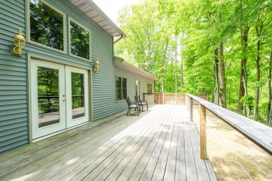 Nestled in a quiet cul-de-sac, this beautifully updated on Point O Woods Country Club in Michigan - for sale on GolfHomes.com, golf home, golf lot