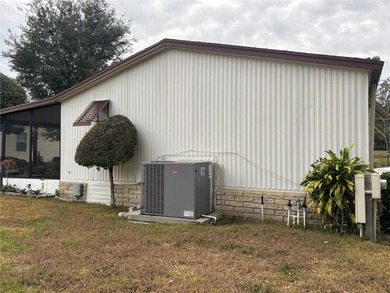 Welcome to this desirable split-bedroom home in the gated on Zellwood Station Country Club in Florida - for sale on GolfHomes.com, golf home, golf lot