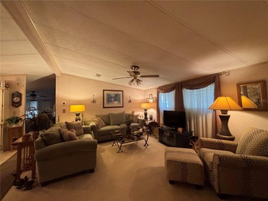 Welcome to this desirable split-bedroom home in the gated on Zellwood Station Country Club in Florida - for sale on GolfHomes.com, golf home, golf lot