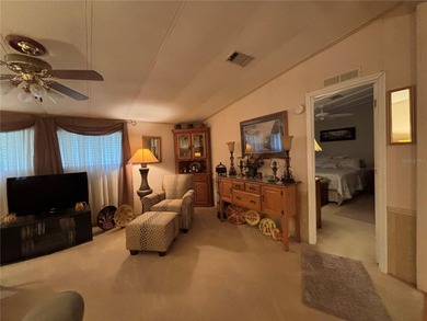 Welcome to this desirable split-bedroom home in the gated on Zellwood Station Country Club in Florida - for sale on GolfHomes.com, golf home, golf lot