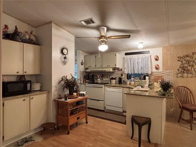 Welcome to this desirable split-bedroom home in the gated on Zellwood Station Country Club in Florida - for sale on GolfHomes.com, golf home, golf lot