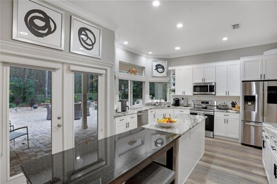 Discover refined elegance in this completely updated on Haile Plantation Golf and Country Club in Florida - for sale on GolfHomes.com, golf home, golf lot