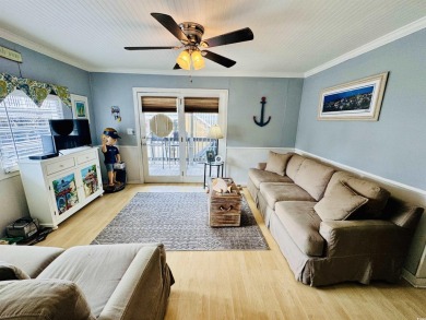 ADORABLE 2 BED/1.5 BATH BEACH HOUSE WITH WRAPAROUND COMPOSITE on Prestwick Country Club in South Carolina - for sale on GolfHomes.com, golf home, golf lot