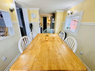 ADORABLE 2 BED/1.5 BATH BEACH HOUSE WITH WRAPAROUND COMPOSITE on Prestwick Country Club in South Carolina - for sale on GolfHomes.com, golf home, golf lot
