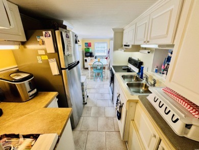ADORABLE 2 BED/1.5 BATH BEACH HOUSE WITH WRAPAROUND COMPOSITE on Prestwick Country Club in South Carolina - for sale on GolfHomes.com, golf home, golf lot