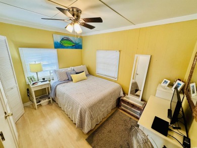 ADORABLE 2 BED/1.5 BATH BEACH HOUSE WITH WRAPAROUND COMPOSITE on Prestwick Country Club in South Carolina - for sale on GolfHomes.com, golf home, golf lot