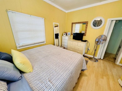 ADORABLE 2 BED/1.5 BATH BEACH HOUSE WITH WRAPAROUND COMPOSITE on Prestwick Country Club in South Carolina - for sale on GolfHomes.com, golf home, golf lot