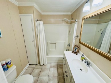 ADORABLE 2 BED/1.5 BATH BEACH HOUSE WITH WRAPAROUND COMPOSITE on Prestwick Country Club in South Carolina - for sale on GolfHomes.com, golf home, golf lot
