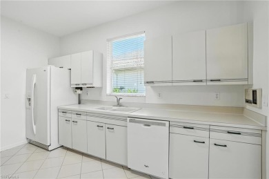 This 2-bedroom plus den villa offers sweeping golf course views on Estero Country Club in Florida - for sale on GolfHomes.com, golf home, golf lot