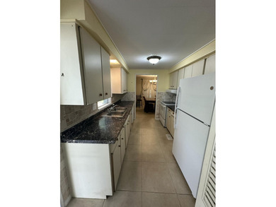 Rarely available lakefront 2BR/2BA double-wide coach home in on Boca Grove Golf and Tennis in Florida - for sale on GolfHomes.com, golf home, golf lot