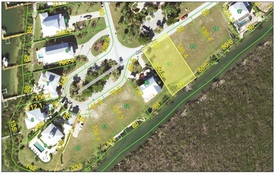 Under contract-accepting backup offers. Waterfront lot in the on Coral Creek Club in Florida - for sale on GolfHomes.com, golf home, golf lot