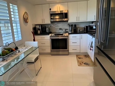 Stunningly renovated 8th floor *F* unit in coveted Building 114 on Palm-Aire Country Club and Resort - Palms in Florida - for sale on GolfHomes.com, golf home, golf lot