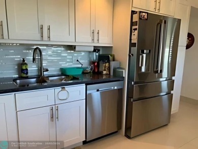 Stunningly renovated 8th floor *F* unit in coveted Building 114 on Palm-Aire Country Club and Resort - Palms in Florida - for sale on GolfHomes.com, golf home, golf lot