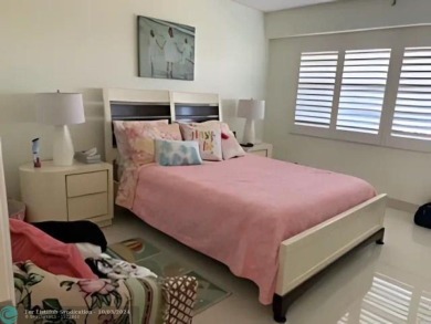 Stunningly renovated 8th floor *F* unit in coveted Building 114 on Palm-Aire Country Club and Resort - Palms in Florida - for sale on GolfHomes.com, golf home, golf lot