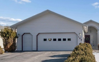 Wake up to sweeping golf course and mountain views in this on Village Greens Golf Club in Montana - for sale on GolfHomes.com, golf home, golf lot
