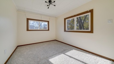 This cozy, updated cottage is the perfect retreat, offering on Ingersoll Golf Course and Learning Links in Illinois - for sale on GolfHomes.com, golf home, golf lot