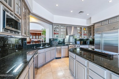 Experience one of Lake Havasu's most iconic residences, a true on London Bridge Golf Course in Arizona - for sale on GolfHomes.com, golf home, golf lot