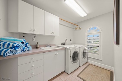 This impeccably maintained traditional style home sits on a on Beachview Golf Club in Florida - for sale on GolfHomes.com, golf home, golf lot