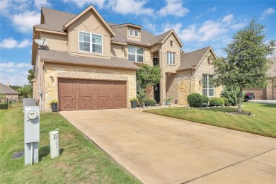 Elegant residence located at the first hole of the golf course on The Golf Club at Resort Eagle Mountain Lake in Texas - for sale on GolfHomes.com, golf home, golf lot