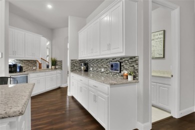 Elegant residence located at the first hole of the golf course on The Golf Club at Resort Eagle Mountain Lake in Texas - for sale on GolfHomes.com, golf home, golf lot