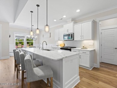 Experience exceptional coastal living at 429 Jackline Drive, a on Olde Point Golf and Country Club in North Carolina - for sale on GolfHomes.com, golf home, golf lot