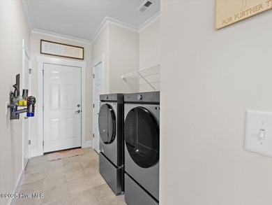 Experience exceptional coastal living at 429 Jackline Drive, a on Olde Point Golf and Country Club in North Carolina - for sale on GolfHomes.com, golf home, golf lot