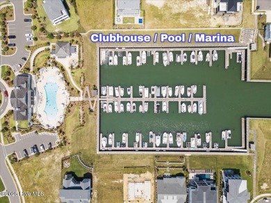 Experience exceptional coastal living at 429 Jackline Drive, a on Olde Point Golf and Country Club in North Carolina - for sale on GolfHomes.com, golf home, golf lot