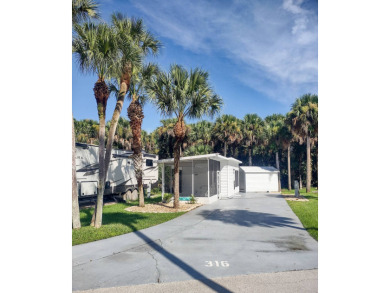 This lovely shaded RV lot with air conditioned 12x8 Florida Room on The Great Outdoors Golf and Country Club in Florida - for sale on GolfHomes.com, golf home, golf lot