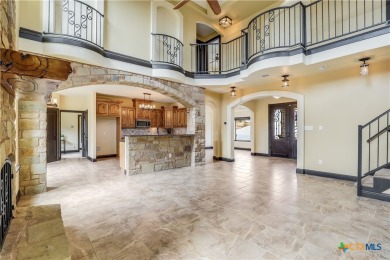 This luxurious Mediterranean-style home boasts of views of Lake on Highland Lakes Golf Course in Texas - for sale on GolfHomes.com, golf home, golf lot