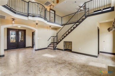 This luxurious Mediterranean-style home boasts of views of Lake on Highland Lakes Golf Course in Texas - for sale on GolfHomes.com, golf home, golf lot