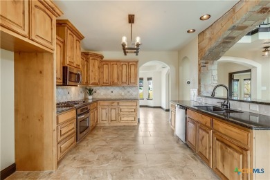 This luxurious Mediterranean-style home boasts of views of Lake on Highland Lakes Golf Course in Texas - for sale on GolfHomes.com, golf home, golf lot