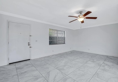 LOVELY UPDATED UNIT WITH WHITE CABINETRY AND STAINLESS STEEL on Kings Point Golf -Flanders Way in Florida - for sale on GolfHomes.com, golf home, golf lot