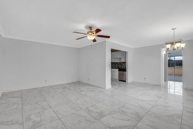 LOVELY UPDATED UNIT WITH WHITE CABINETRY AND STAINLESS STEEL on Kings Point Golf -Flanders Way in Florida - for sale on GolfHomes.com, golf home, golf lot