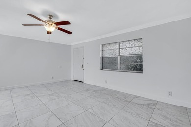 LOVELY UPDATED UNIT WITH WHITE CABINETRY AND STAINLESS STEEL on Kings Point Golf -Flanders Way in Florida - for sale on GolfHomes.com, golf home, golf lot