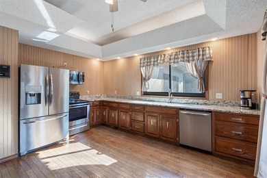 Sprawling lakefront retreat with easy walking access to the on Holiday Island Executive Golf Course in Arkansas - for sale on GolfHomes.com, golf home, golf lot