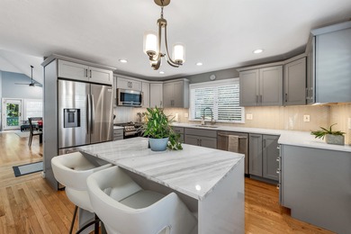 Welcome to this stunning end-unit townhome in the highly on Sky Meadow Country Club in New Hampshire - for sale on GolfHomes.com, golf home, golf lot