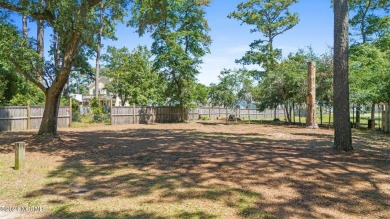 Nestled among some of the most majestic live oaks in Southport on The Lakes Country Club in North Carolina - for sale on GolfHomes.com, golf home, golf lot