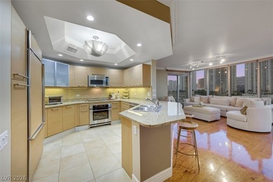 Stunning corner residence with dramatic curved floor-to-ceiling on  in Nevada - for sale on GolfHomes.com, golf home, golf lot