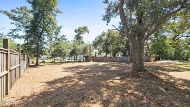 Nestled among some of the most majestic live oaks in Southport on The Lakes Country Club in North Carolina - for sale on GolfHomes.com, golf home, golf lot